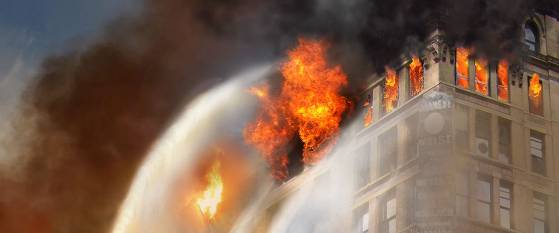 Illustration of flames bursting out of the windows of a building as water is sprayed to put it out