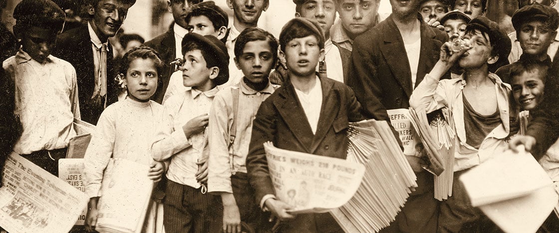 Black & white photo of children selling newspapers