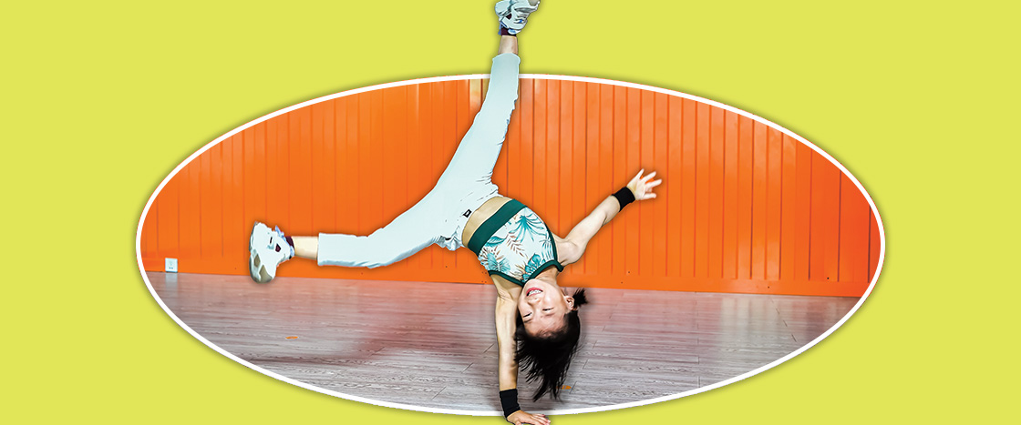 Image of kid performing a one-handed cartwheel