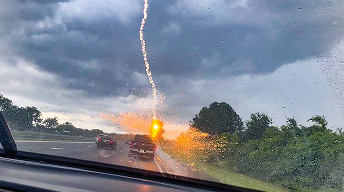 A Chaotic Thundercloud with Lightning Strikes Within by Derrick Neill