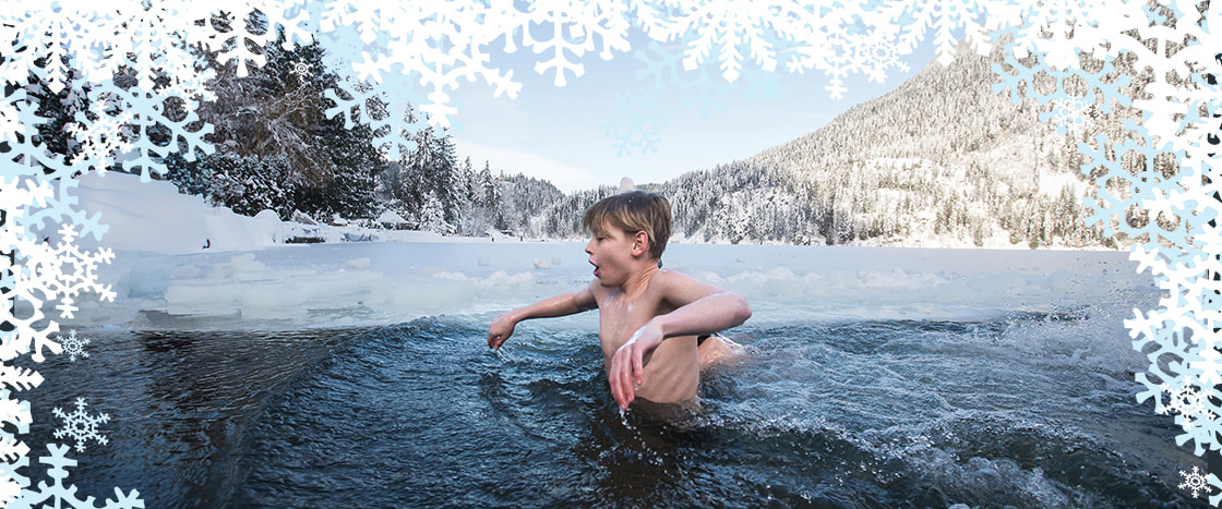 Photo of a kid swimming in ice cold water