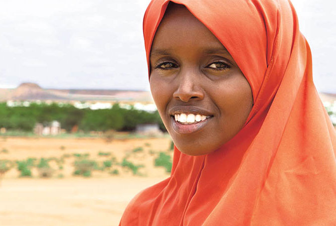 A girl smiling with a hijab